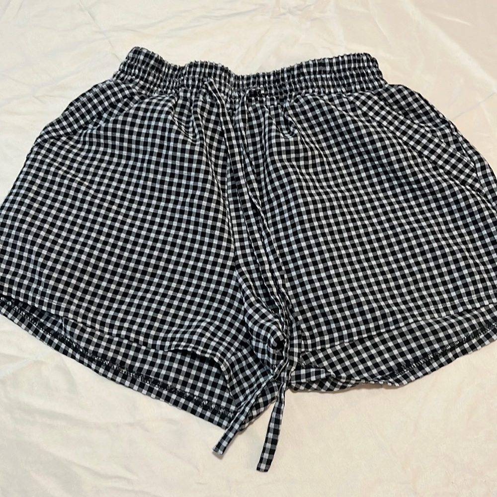 Sienna Sky. Black checkered shorts
